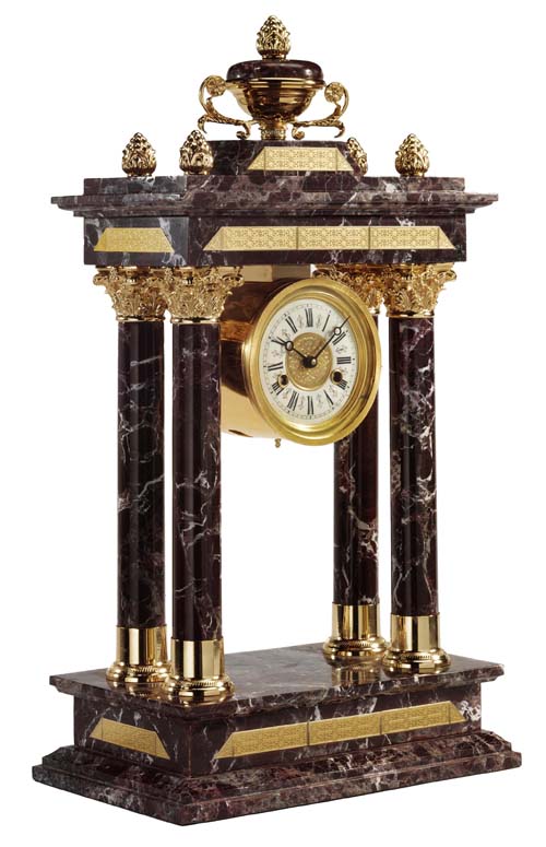 antique clock on an elegant fireplace