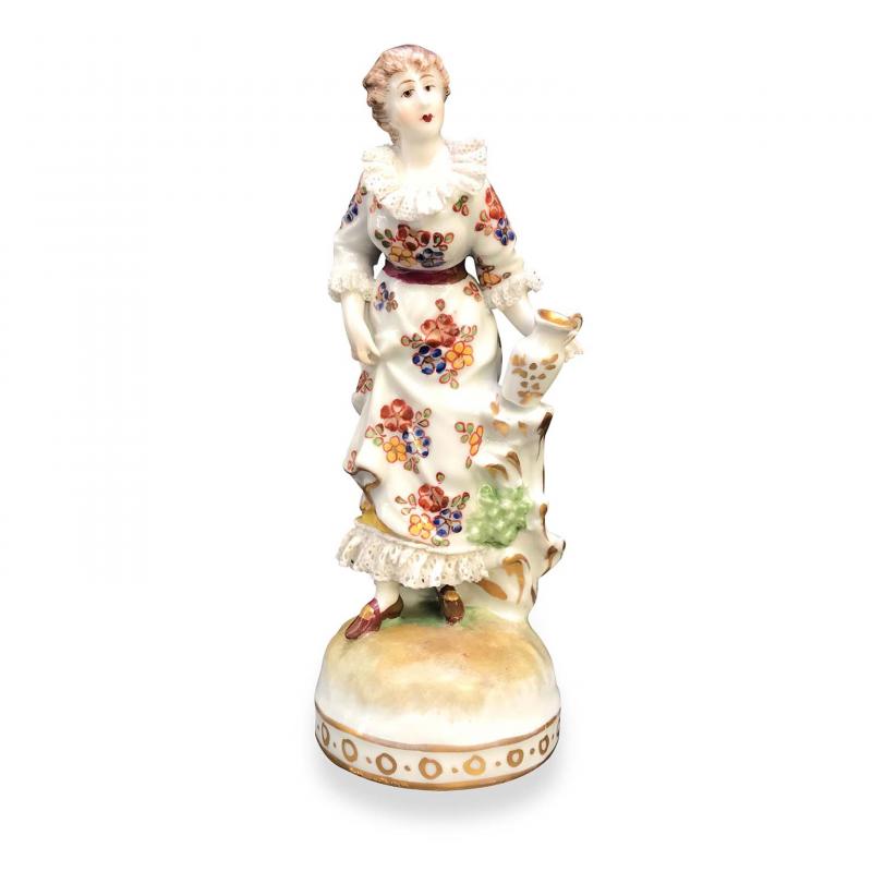 Figurine of a Woman With Floral Decorations