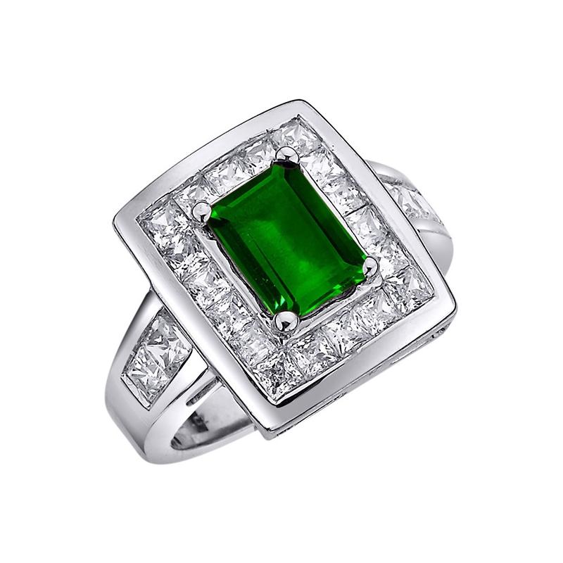 Ring with emerald and diamonds as a gift for a woman