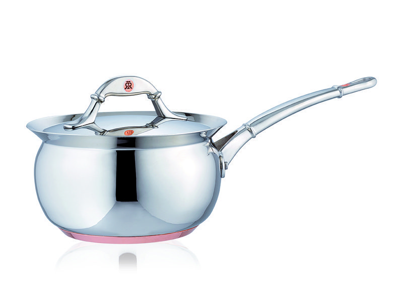 cooking in a stainless steel and copper pot