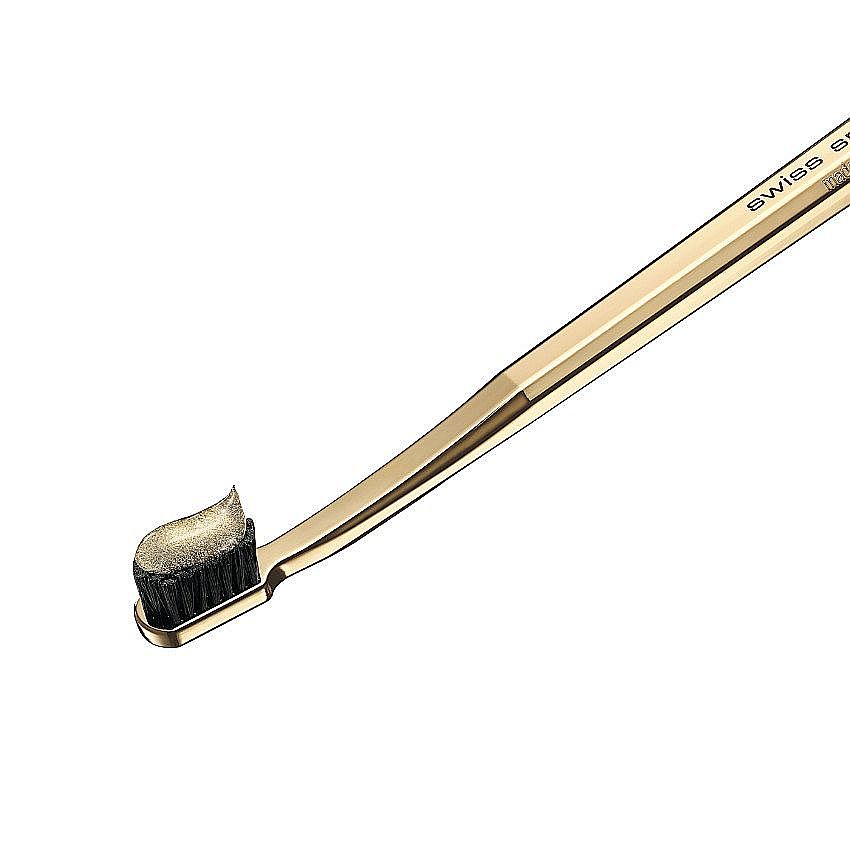 gold toothbrush